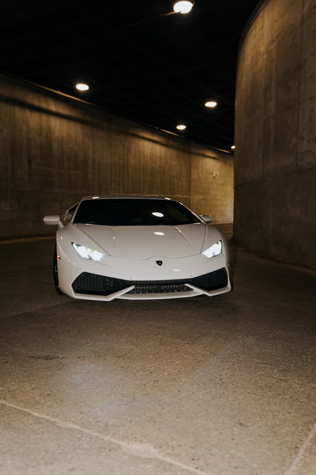 White luxury vehicle featured as part of the Black Card private event environment.