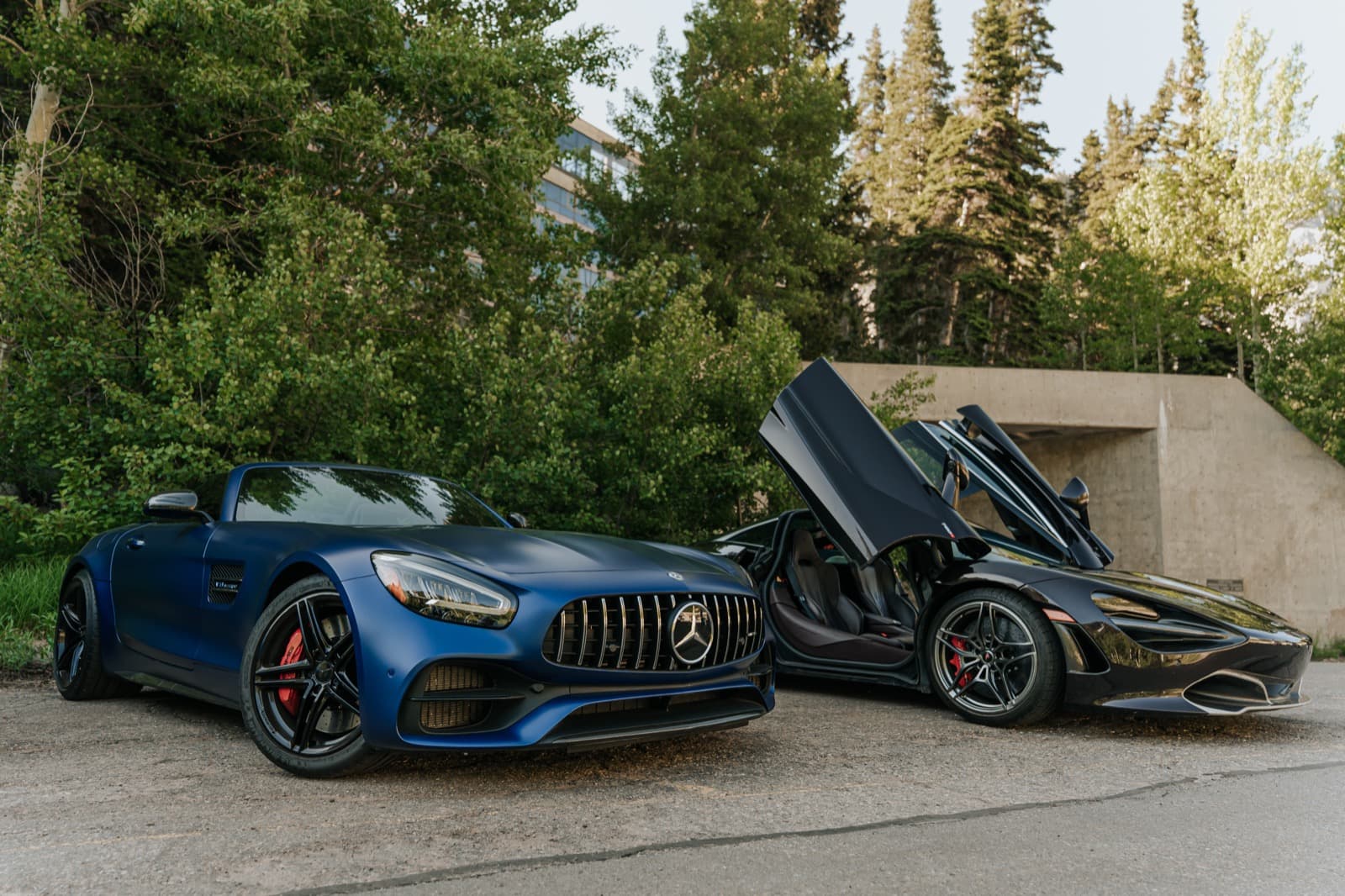 Blue luxury car parked outside during the Black Card event experience.